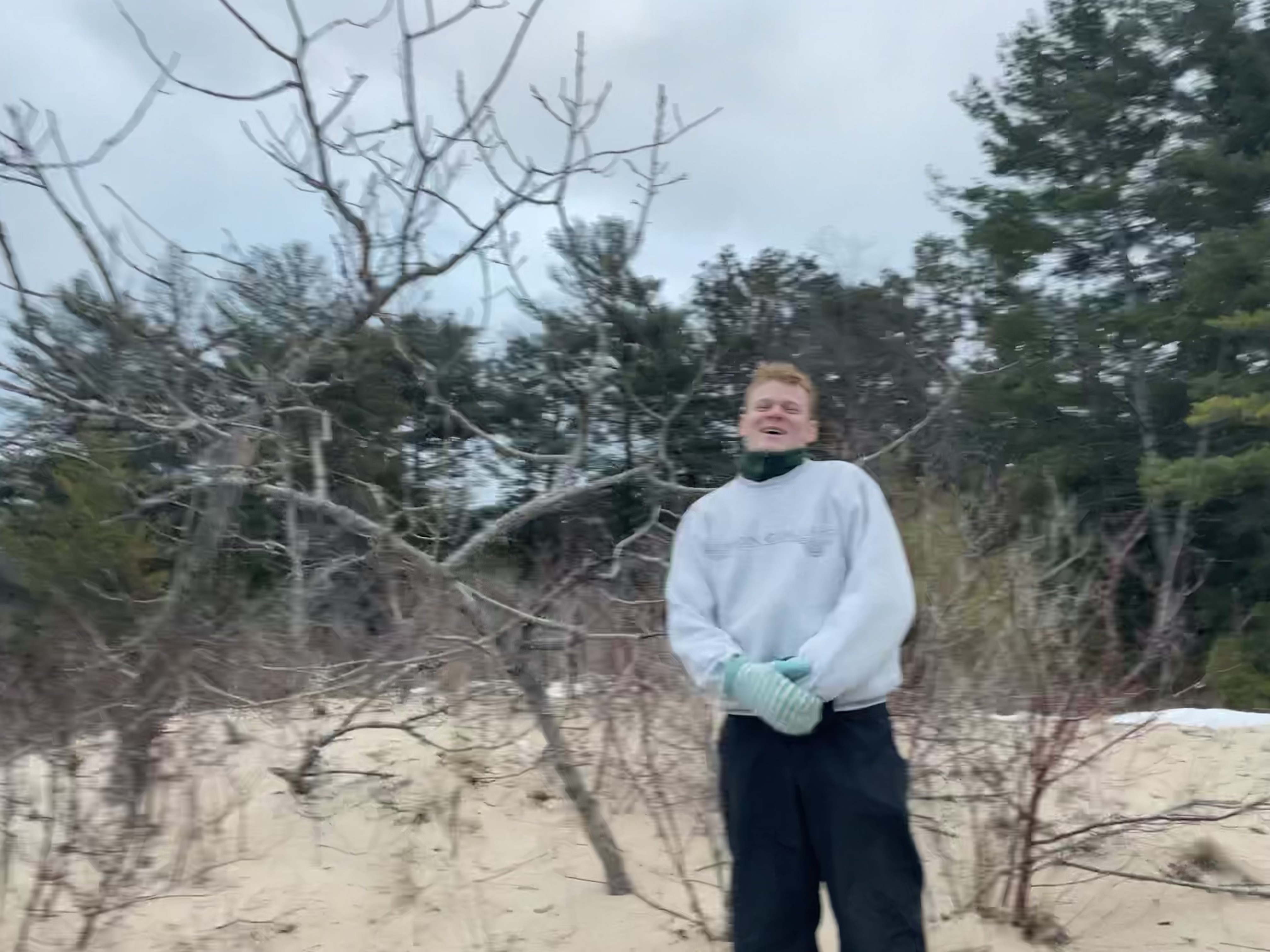 An image of Austin Thomasson laughing in the snow